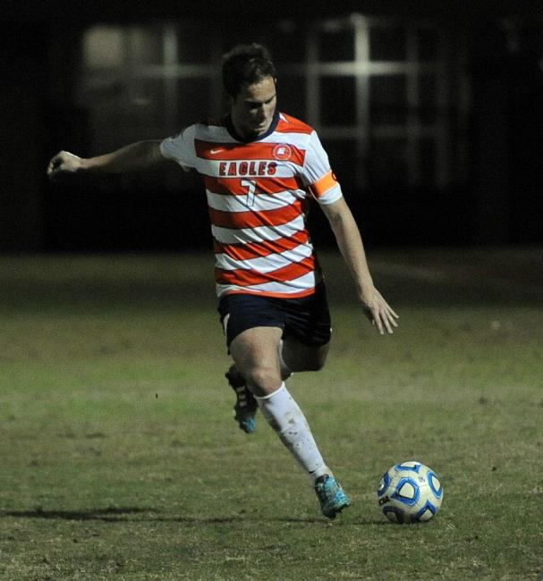 Kristian Speake pumps the ball forward Kristian Speake pumps the ball forward